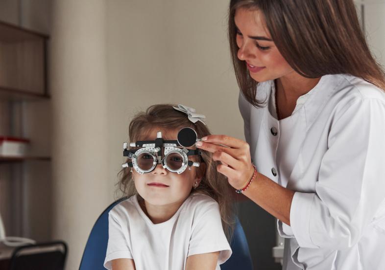 child receiving myopia exam